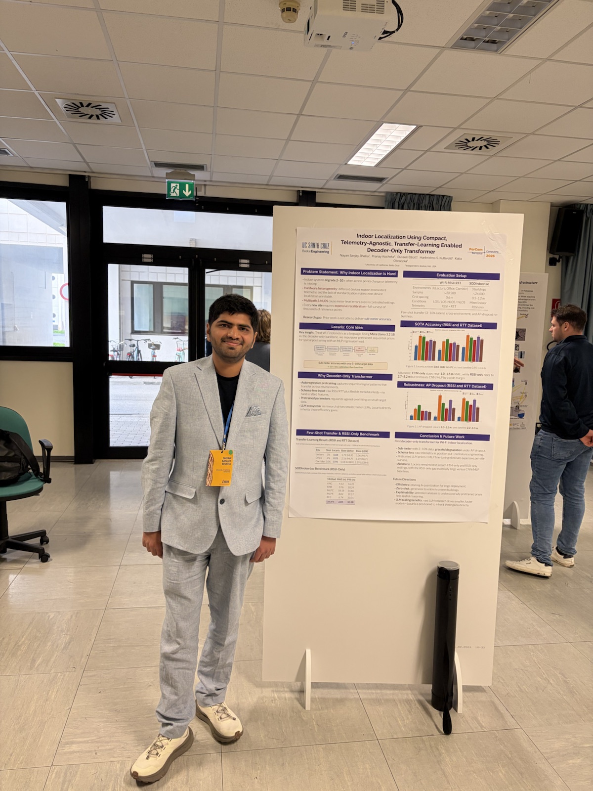 Nayan Bhatia presenting the Locaris poster at PerCom 2026